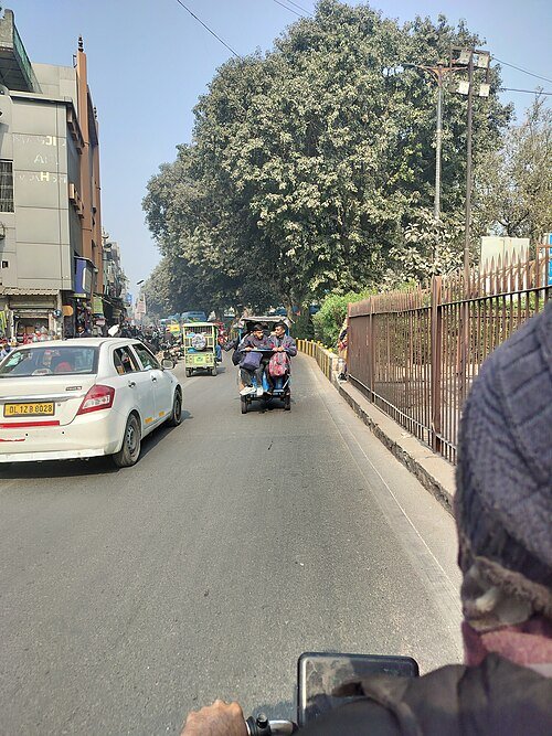 Electric rickshaw in Delhi, representing the three-wheeler segment that outpaces electric cars under PLI-Auto