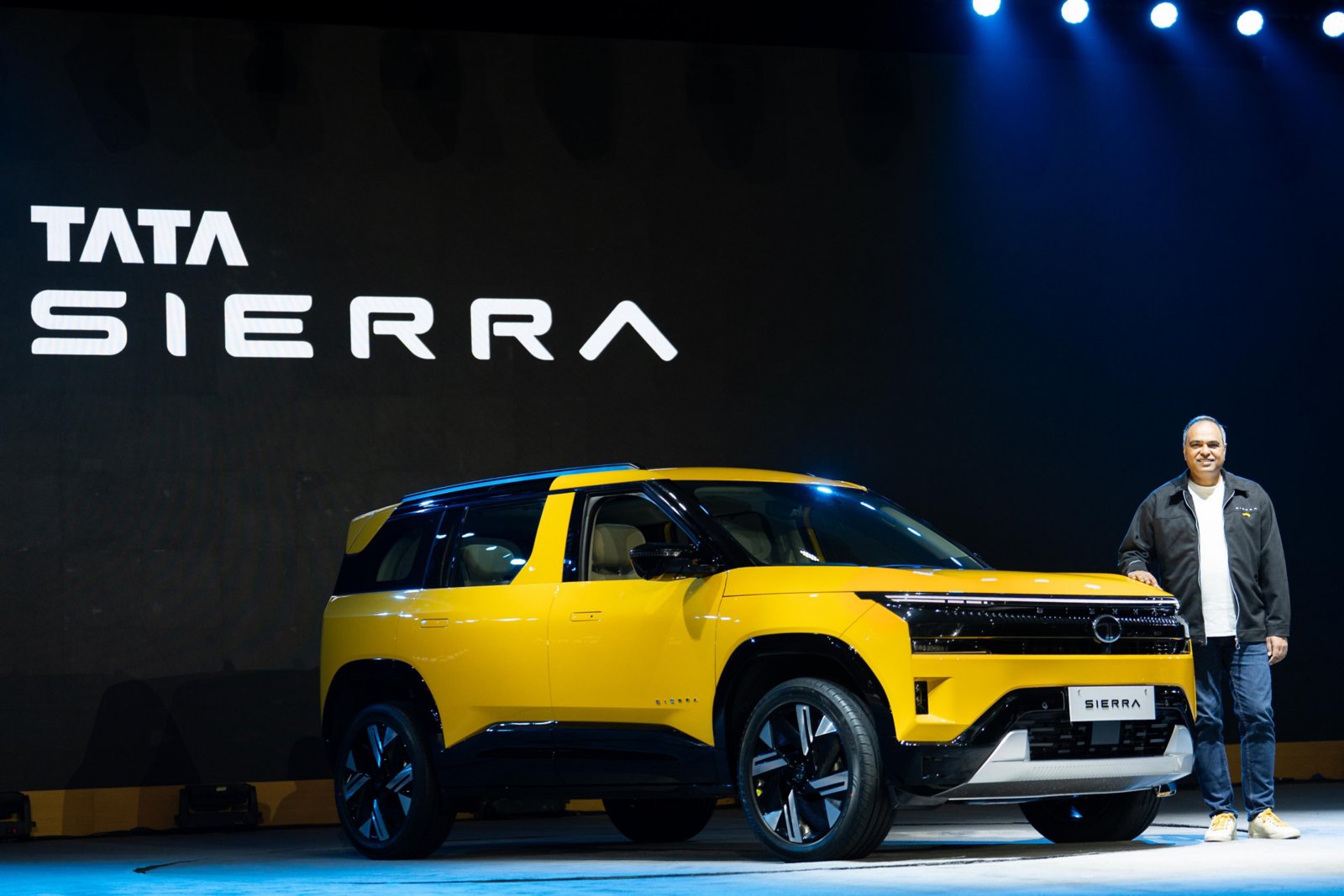 Tata Sierra 2026 revealed on stage in yellow paint