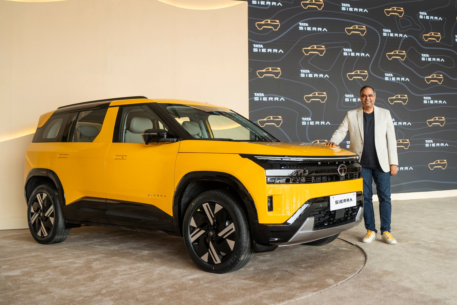 Tata Sierra 2026 front three-quarter studio shot showing grille and alloy wheels