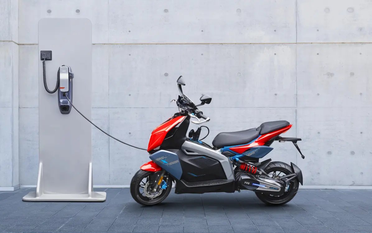 TVS X topping up at a charging point
