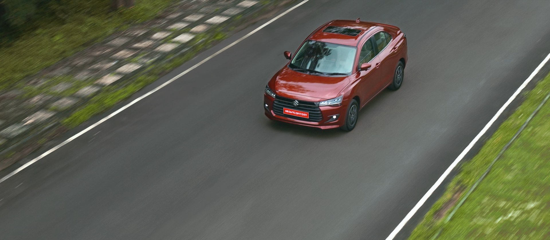 Maruti Suzuki Dzire, on a winding road