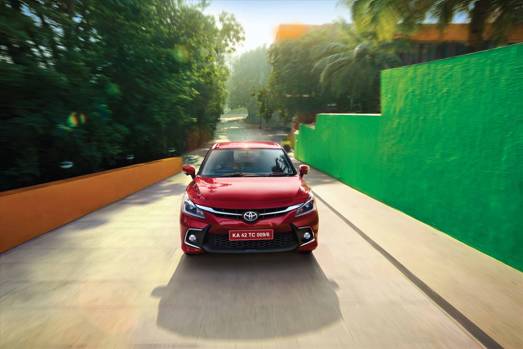 Toyota Glanza driving on an open road