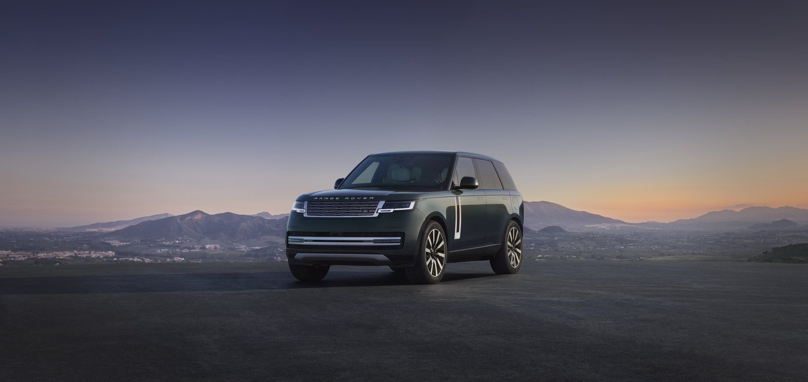 Range Rover Electric front three-quarter view at dusk