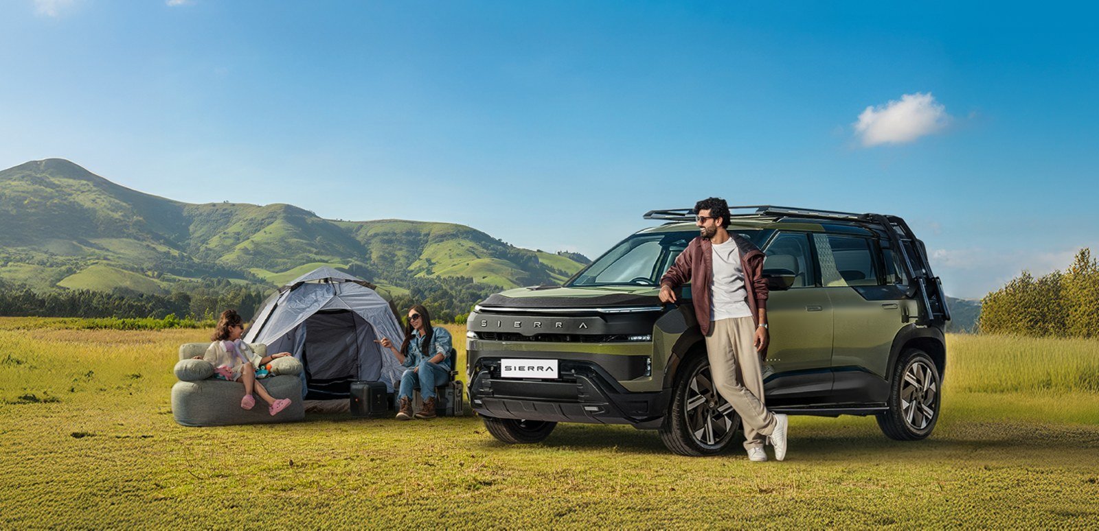 Tata Sierra parked beside a family camping in the hills