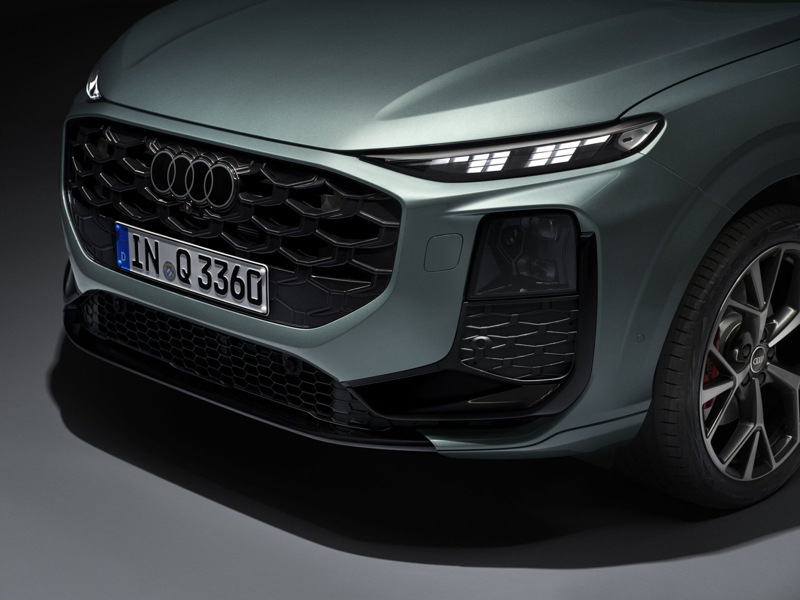 New Audi Q3 front grille and split LED headlight close-up detail