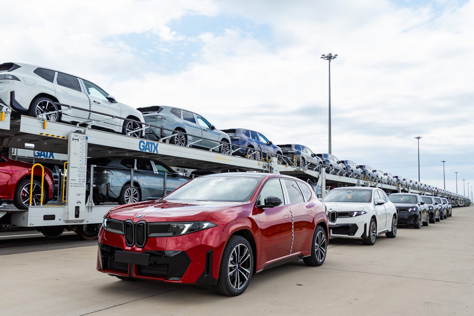 New BMW vehicles loaded onto a rail car carrier for delivery