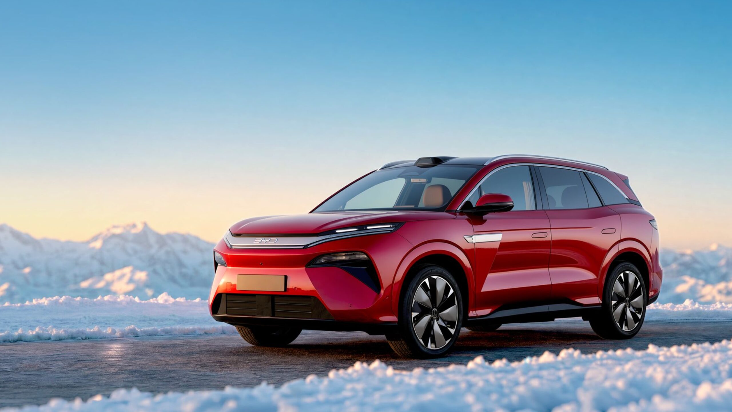 BYD Atto 8 parked in snow, front three-quarter view