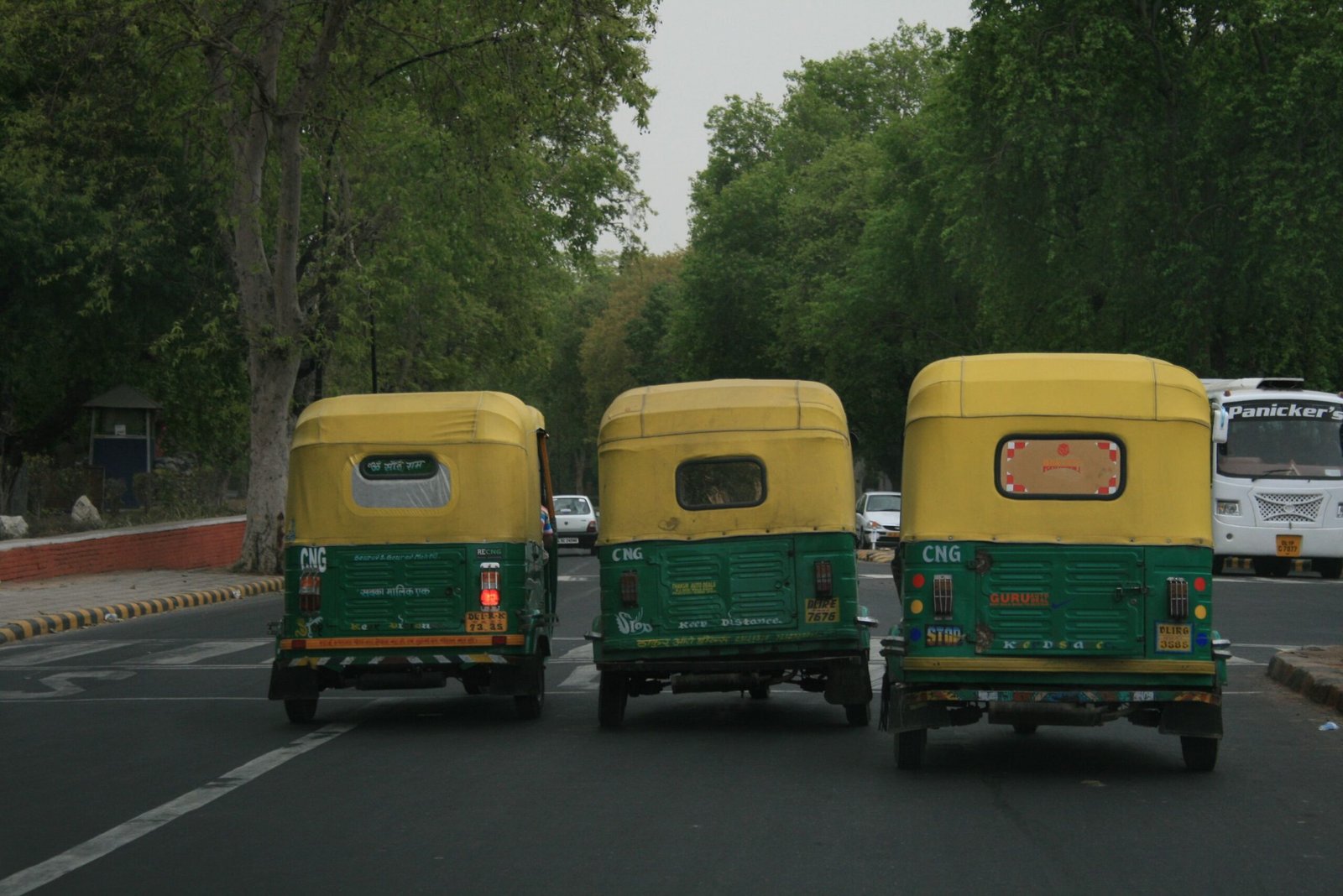 CNG auto-rickshaws on an Indian road