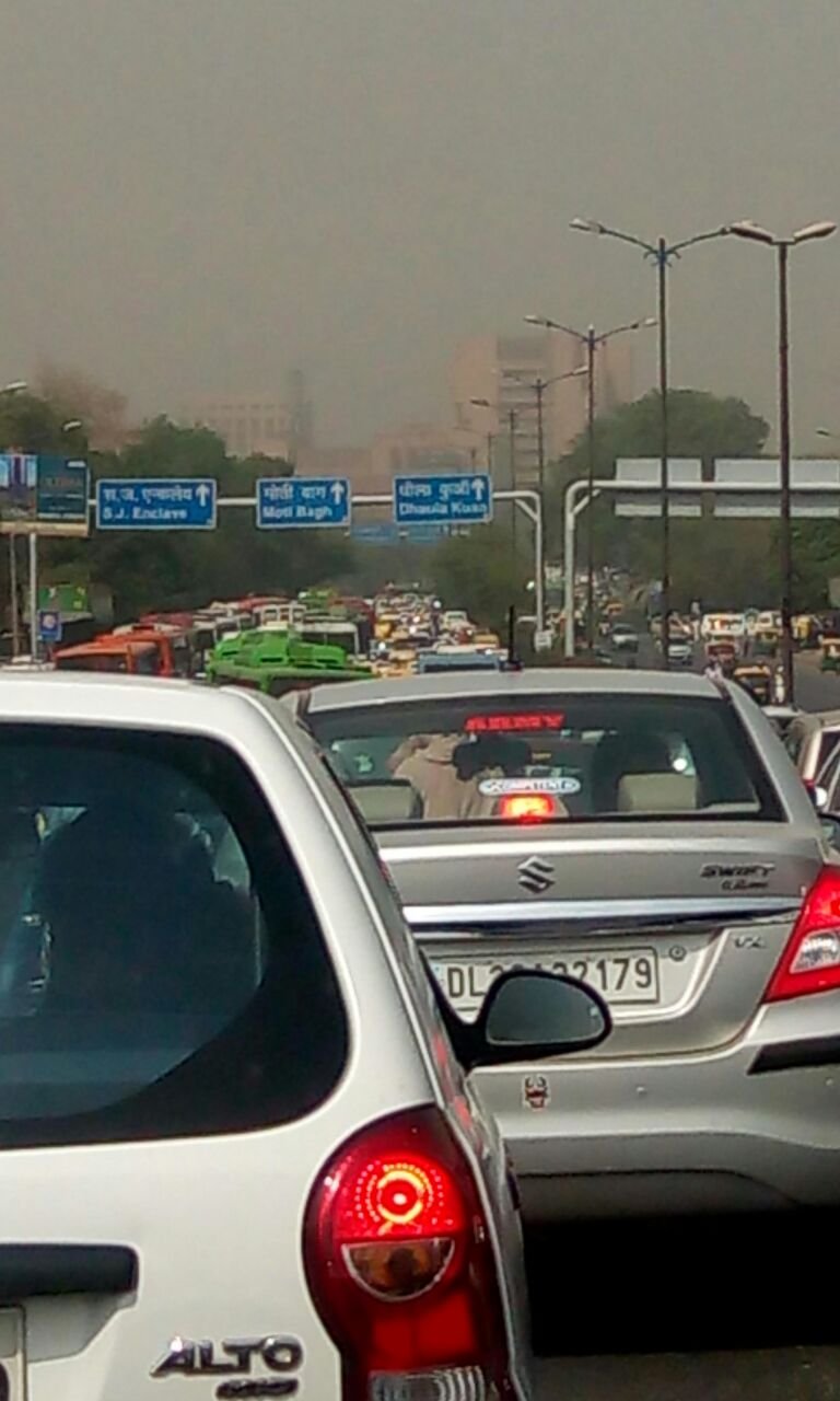 Cars queued in smog-covered traffic near Dhaula Kuan in Delhi