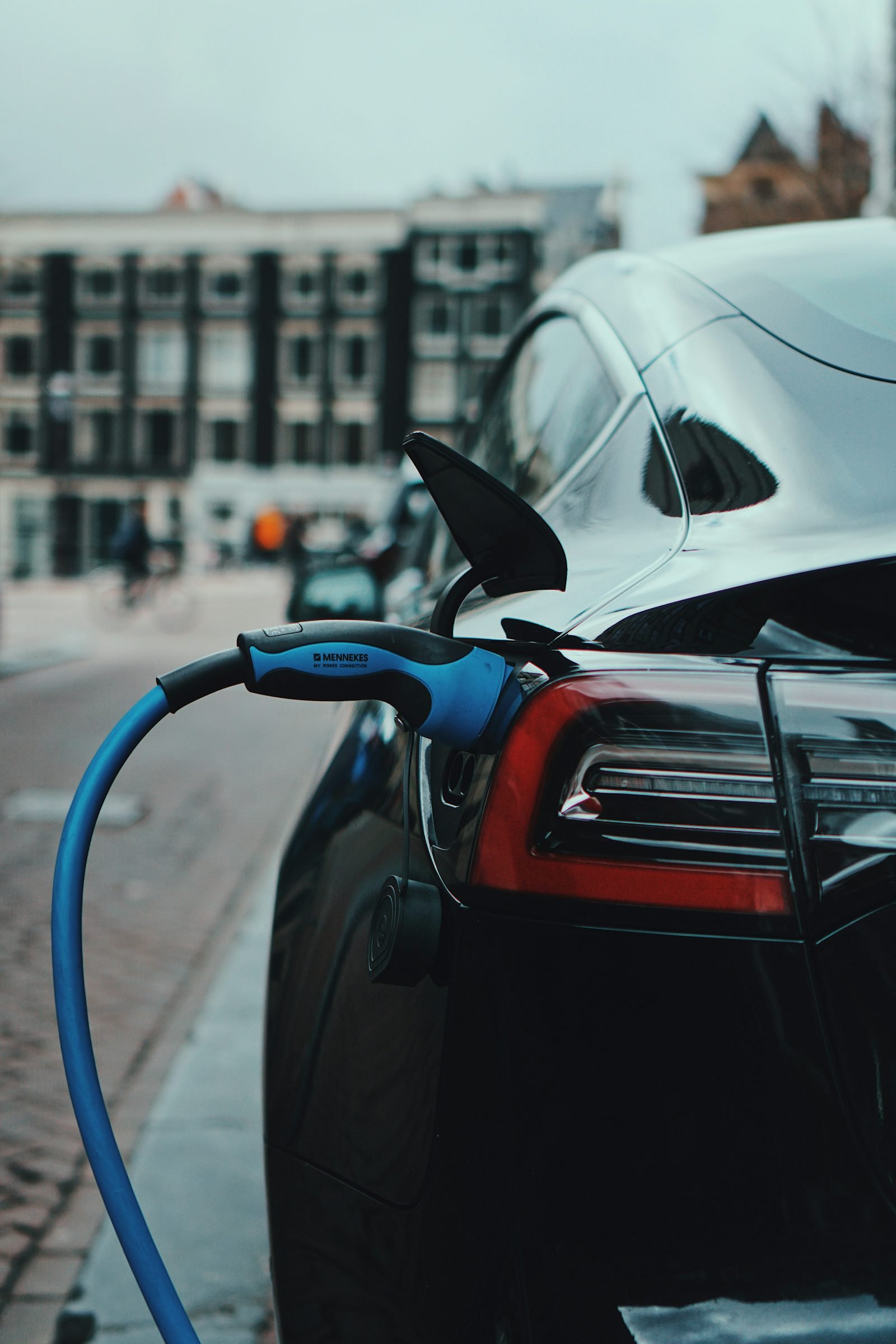 An EV plugged into a DC fast charging connector