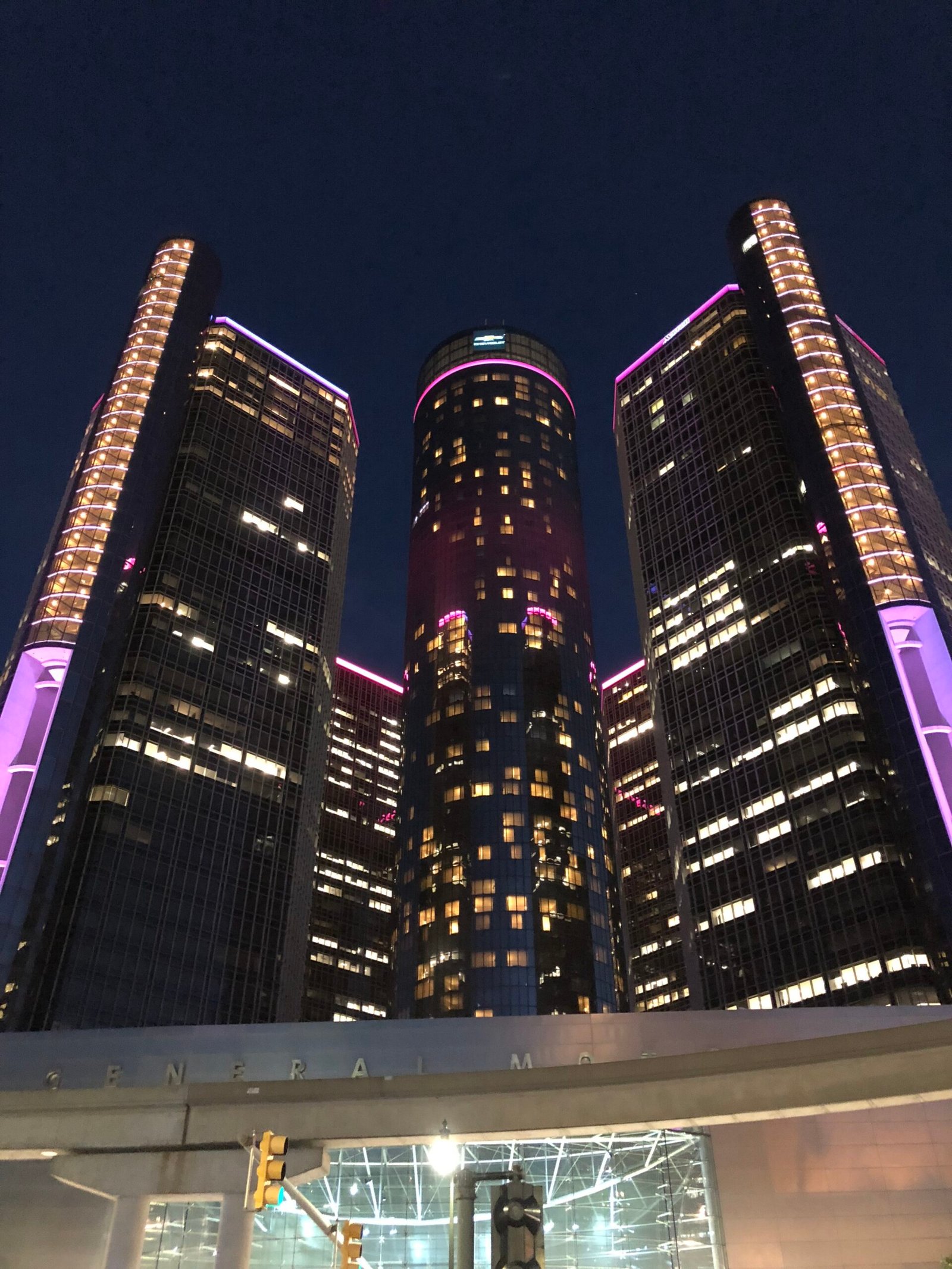 GM Renaissance Center headquarters towers lit up at night in Detroit