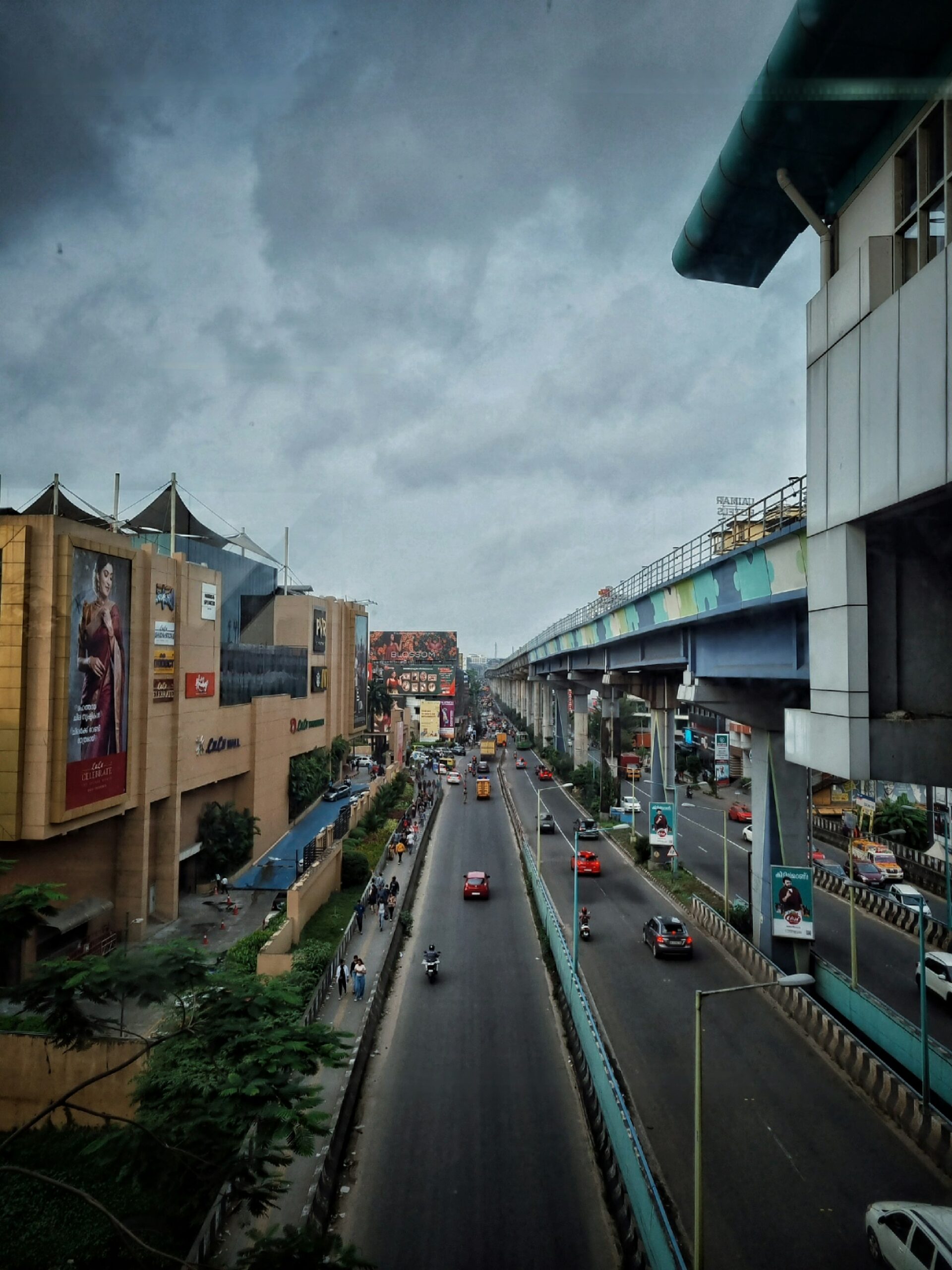 Busy Indian street with petrol cars, scooters, and traffic