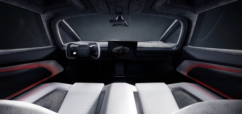 Tesla Roadster cabin with a steer-by-wire yoke and centre touchscreen